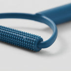 Pet hair scraper used on a car seat