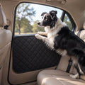 Dog resting paws against a Fetch & Fuzz car door protector