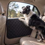Dog resting paws against a Fetch & Fuzz car door protector