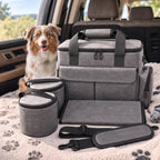 Gray dog travel bag with containers and bowls laid out