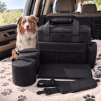Black dog travel bag with dog, showing containers, bowls and shoulder strap