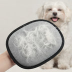 Pet hair mitt lifting hair from upholstery