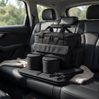 Black dog travel bag packed on a car back seat