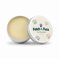 Fetch & Fuzz pet paw balm tin, open, showing the balm