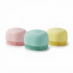 Silicone dog shampoo brush shown in pink, mint and yellow