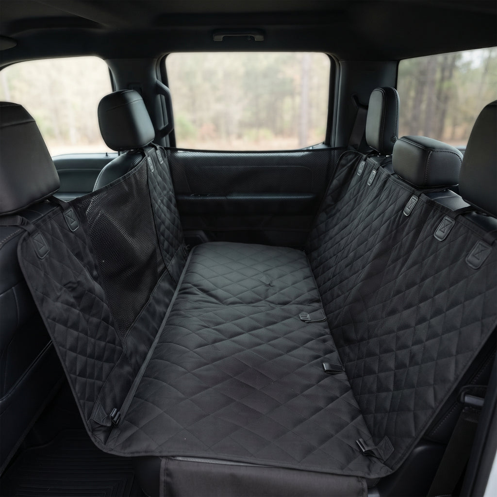 Fetch & Fuzz Dog Car Seat Cover fitted across a truck back seat with the side flaps up