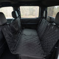 Fetch & Fuzz Dog Car Seat Cover fitted across a truck back seat with the side flaps up