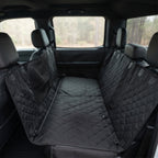 Fetch & Fuzz Dog Car Seat Cover fitted across a truck back seat with the side flaps up